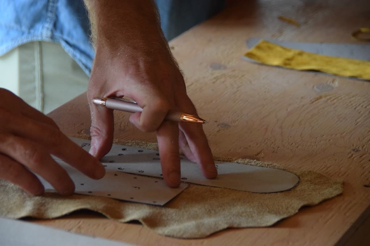 Tracing a pattern onto leather by hand